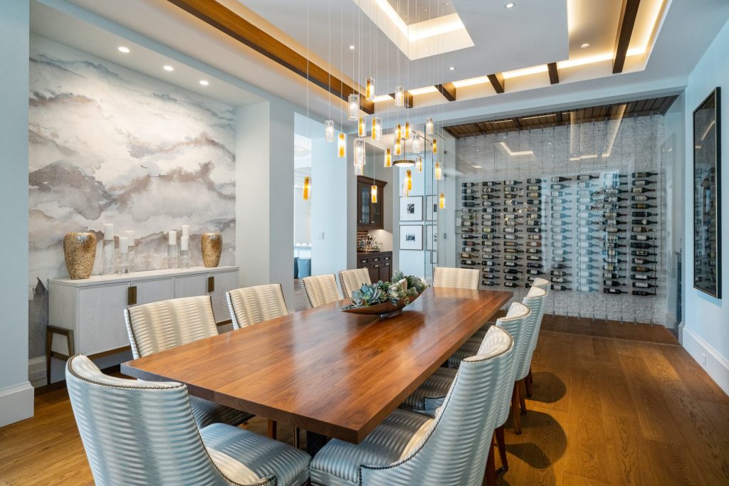 Elegant wine cellar integrated into a dining room, showcasing custom wine storage.