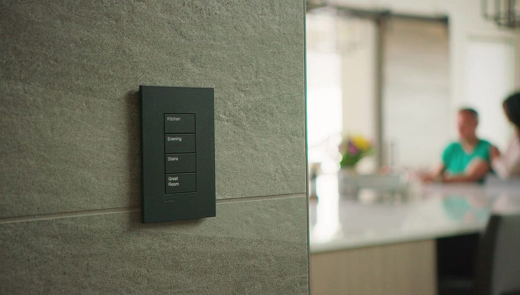 Close-up of modern smart light switches by Brava and Lutron, featuring sleek, touch-sensitive controls for convenient home lighting management.