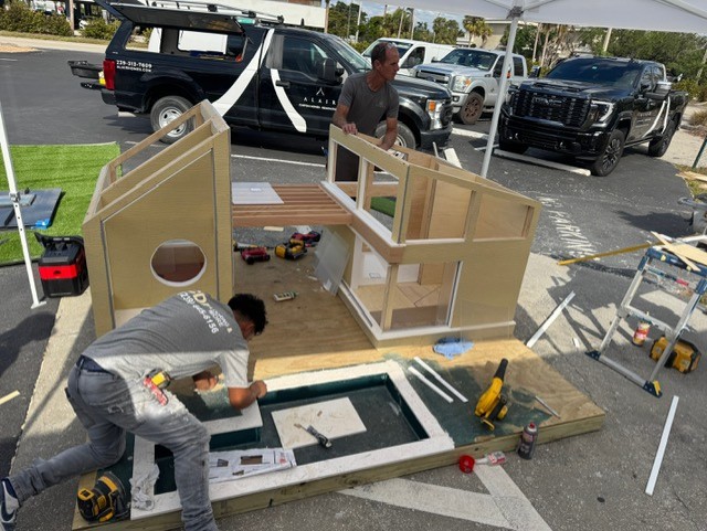 Pool installation for The Woof Lodge dog house by a professional contractor.