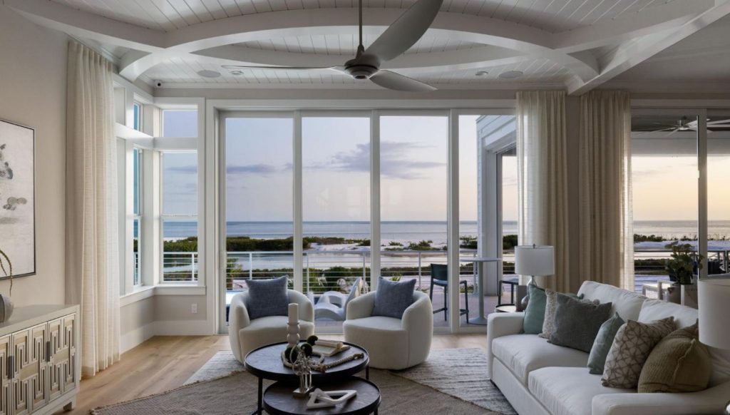 A view of a living space in a new custom home in Florida that overlooks the ocean.